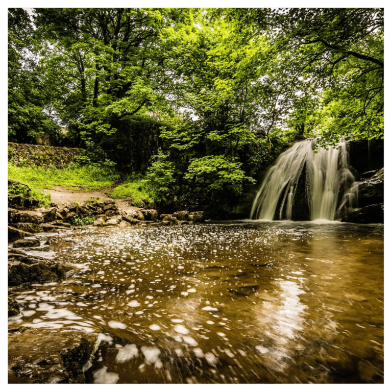 A landscape image of Janet's Foss waterfall