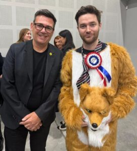 Rob Pownall in fox costume with Andy Burnham at Makerfield by-election